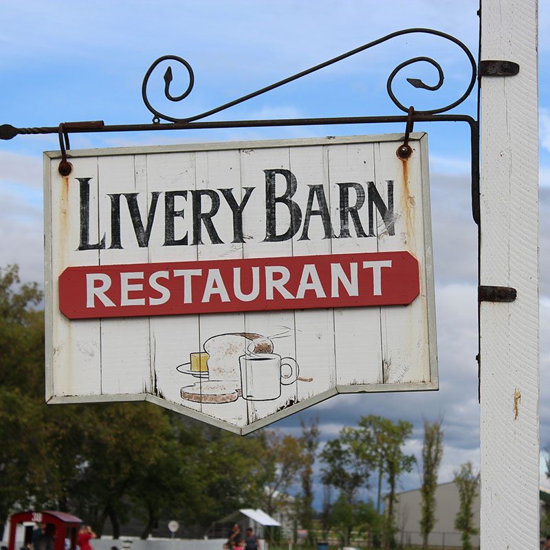 The outdoor sign for the Livery Barn Restaurant.
